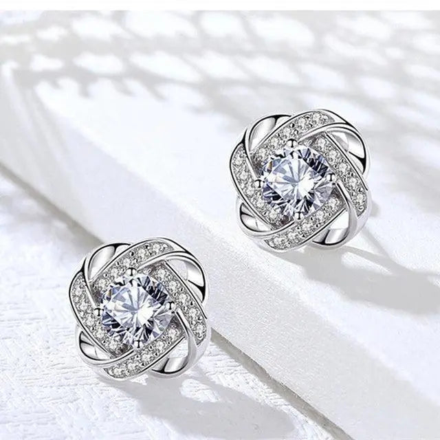Golden spiral earrings with crystals