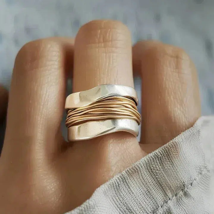Silver ring with golden thread