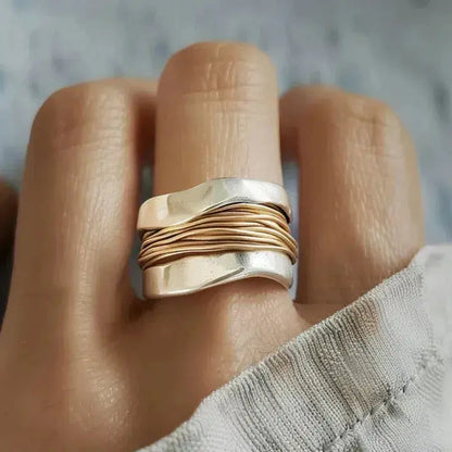 Silver ring with golden thread