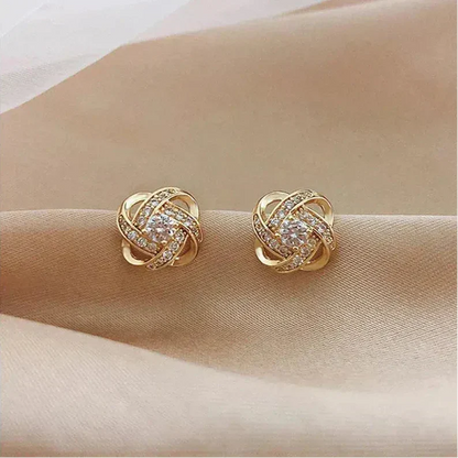 Golden spiral earrings with crystals