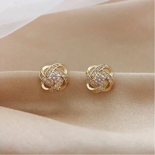 Golden spiral earrings with crystals