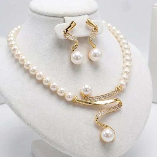 Set of a necklace and earrings with natural pearls