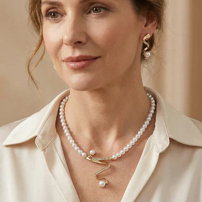Set of a necklace and earrings with natural pearls