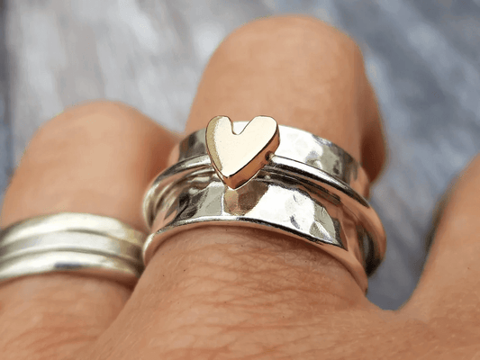 Silver ring with golden heart