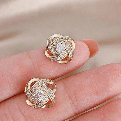Golden spiral earrings with crystals