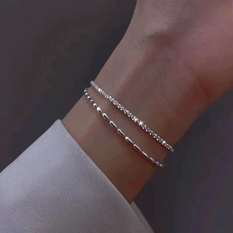 Elegant silver bracelet set with zirconium stones